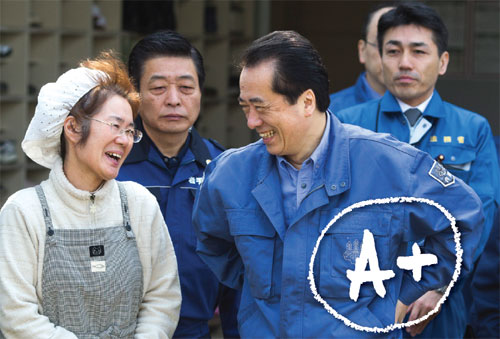 Japan Prime Minister Naoto Kan speaks with an earthquake victim Ryoko Otsubo as he leaves at an evacuation shelter on April 2, 2011 in Rikuzentakata, Iwate, Japan. The death toll continues to rise with numbers of dead and missing exceeding 20,000 in a tragedy not seen since World War II in Japan. Kan has been credited with showing great moral leadership in the face of this crisis. Photo: Athit Perawongmetha/Getty Images