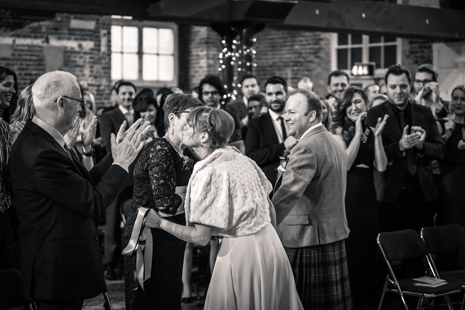 The bride's family congratulate her