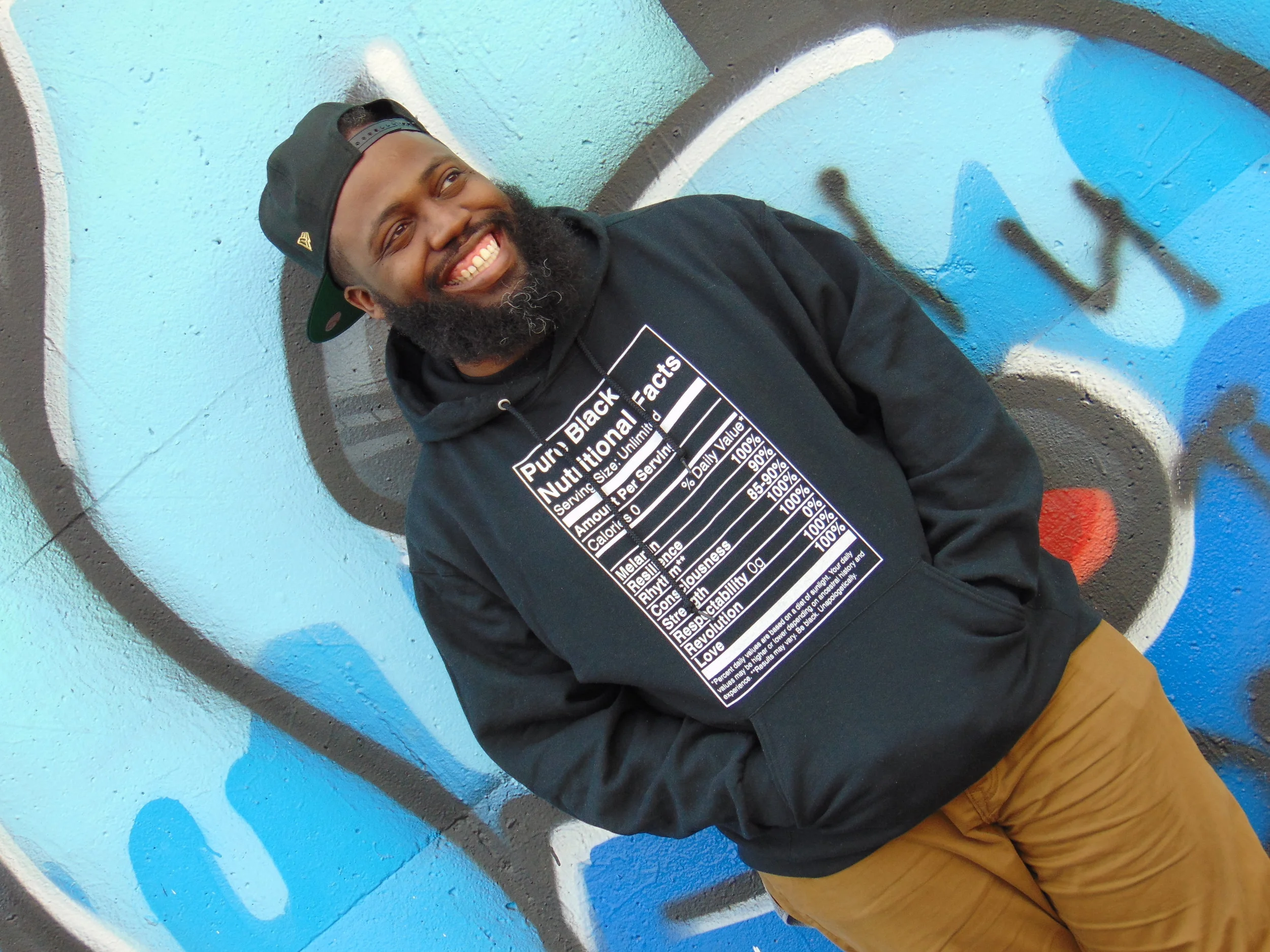 Noble, wearing the original Pure Black Nutritional Facts design.