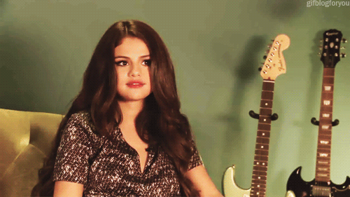 selena gomez shrug GIF-downsized_large.gif