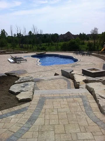 total back yard transformations by Unique Pools & Landscaping Inc.