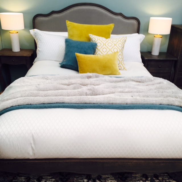 This is a really funky and creative display of cushions! You don't need to have a matching set of cushions. Just have fun and make it look as if you had no time to make your bed properly. It's a beautiful mess