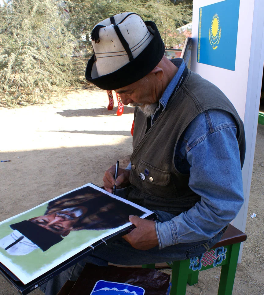 Alik signing his name on a print I took to Al Ain UAE