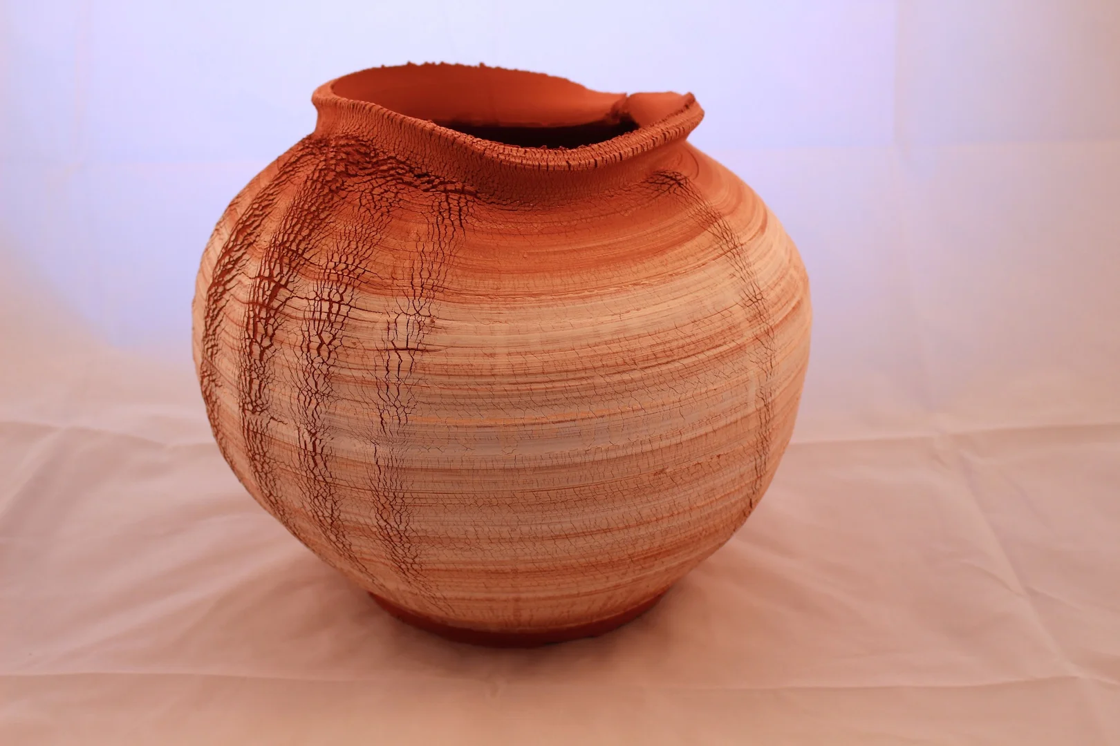 Wheel-thrown and hand-altered ceramic artwork.