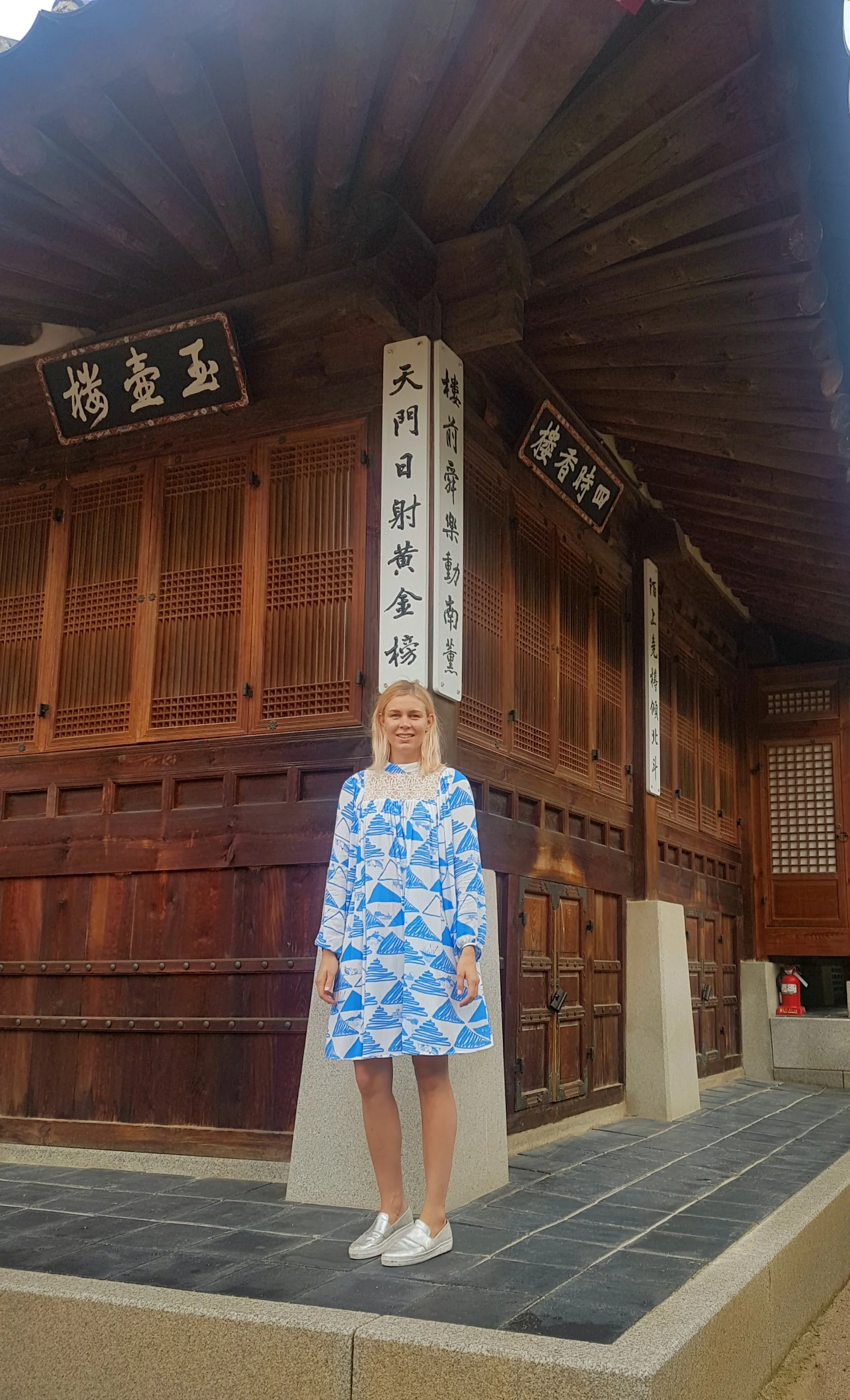 Outside Geoncheonggung Residence wearing Moomin Senja dress by Ivana Helsinki. 