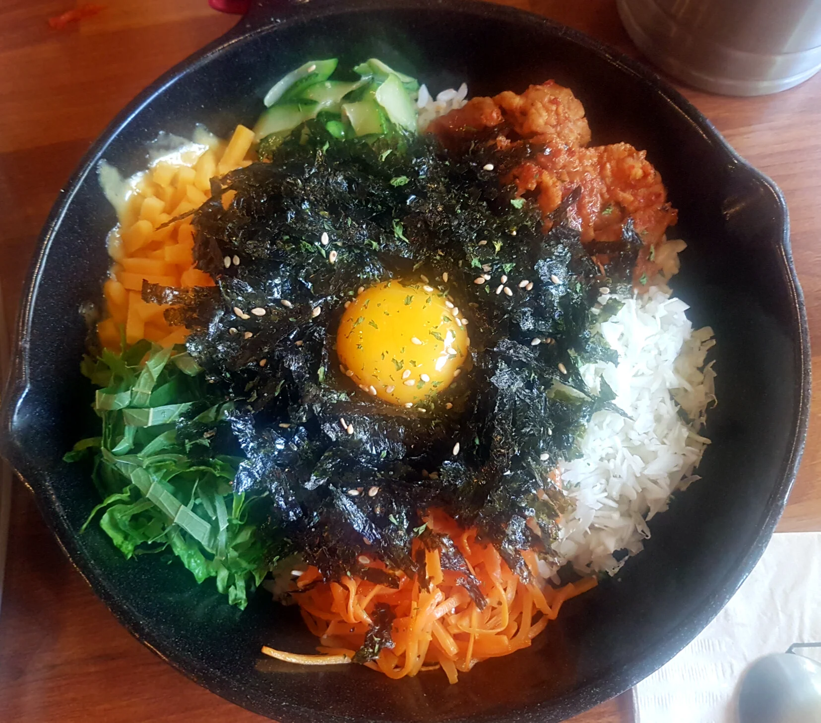 Warm "hot pot" version of bibimbap can look like this for example. This one has even some cheese in the mix. Yam! 