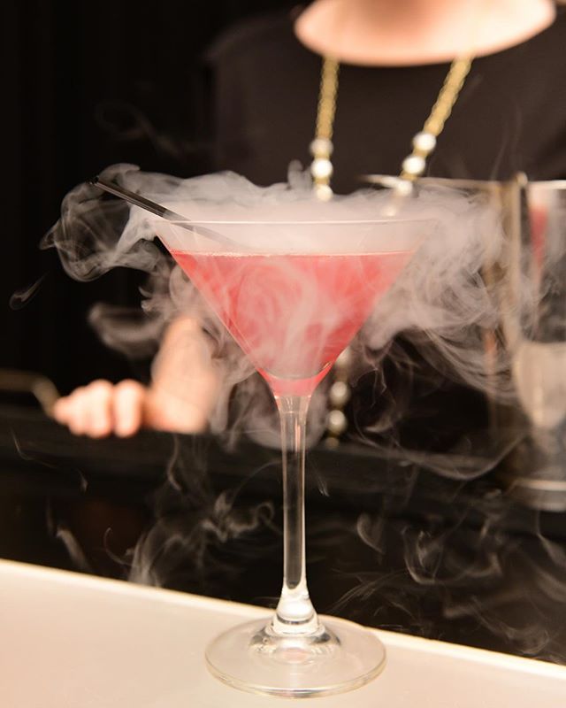 This is our alluring Pomegranate Cosmo smoking cocktail. With its captivating red color, it combines #SkyVodka, @POMWonderful, and Cointreau for this drink that is not too sweet and is so appealing!⠀
&bull;⠀
&bull;⠀
&bull;⠀
The music for this evening