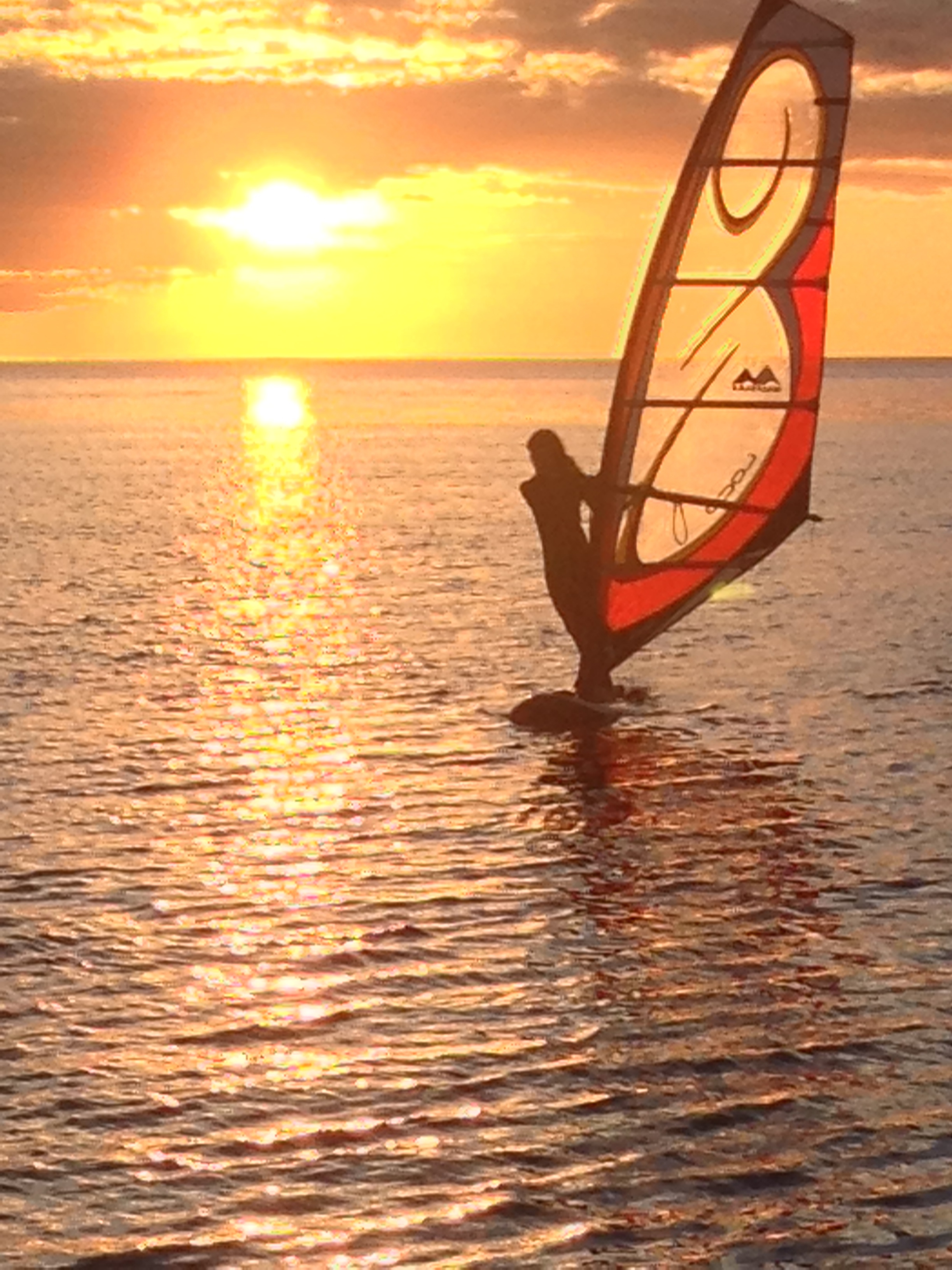 sunset windsurfing