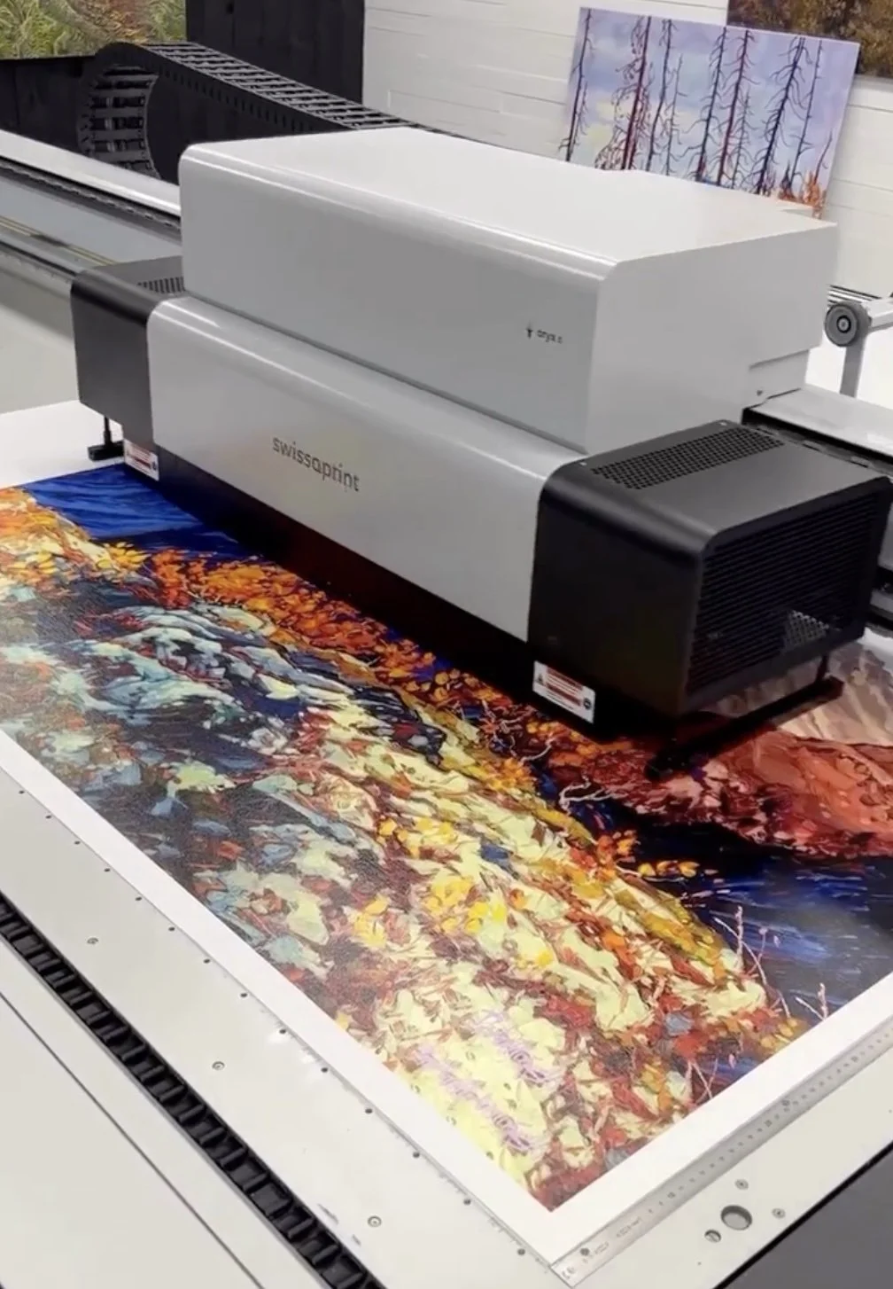 Limited edition giclée prints being produced from an original landscape painting.