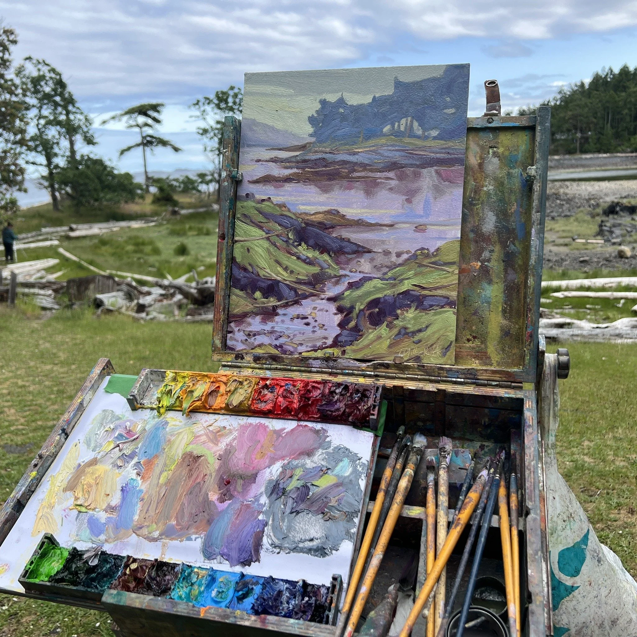 Group of artists painting outdoors in a forest setting during a plein air workshop near Nanaimo, British Columbia.