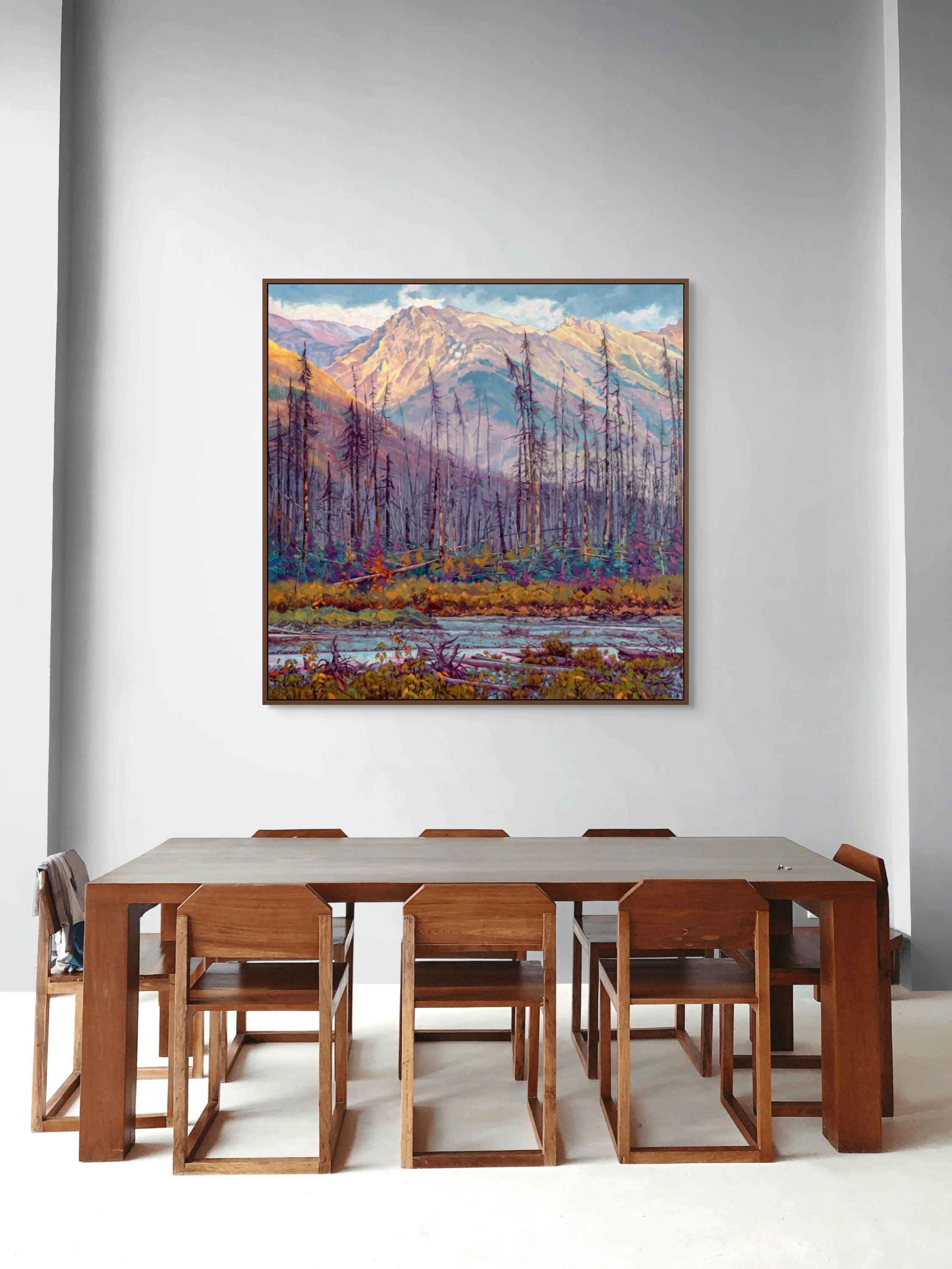 Studio landscape painting of the Kootenay valley in the Canadian Rockies, showing mountains, forest, and river.