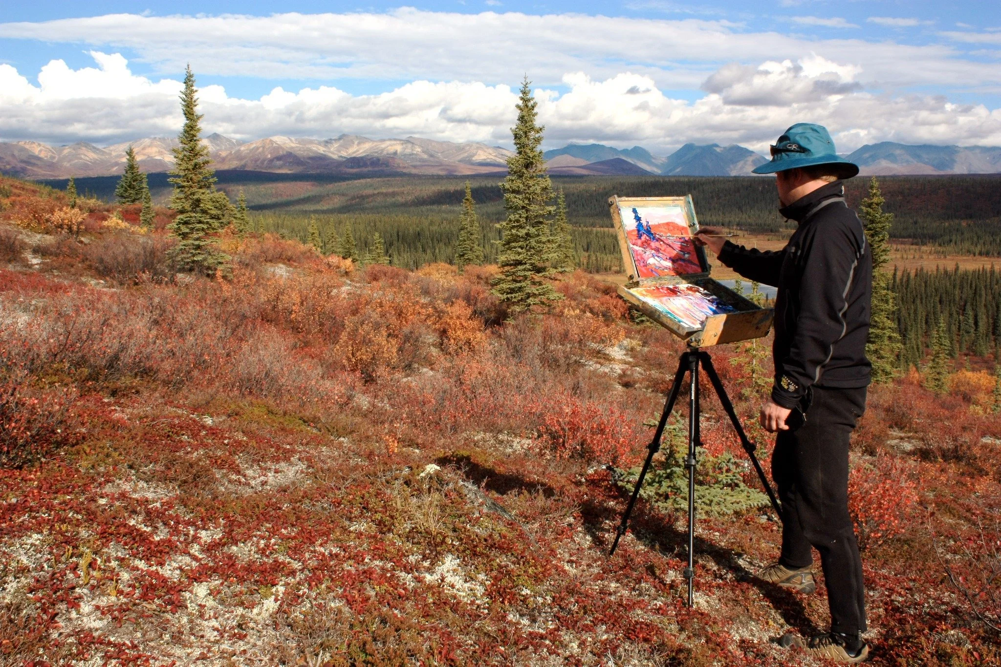 Painting of the Denali mountains in Alaska by Dominik Modlinski, depicting a vast northern landscape with dramatic peaks and atmospheric light.