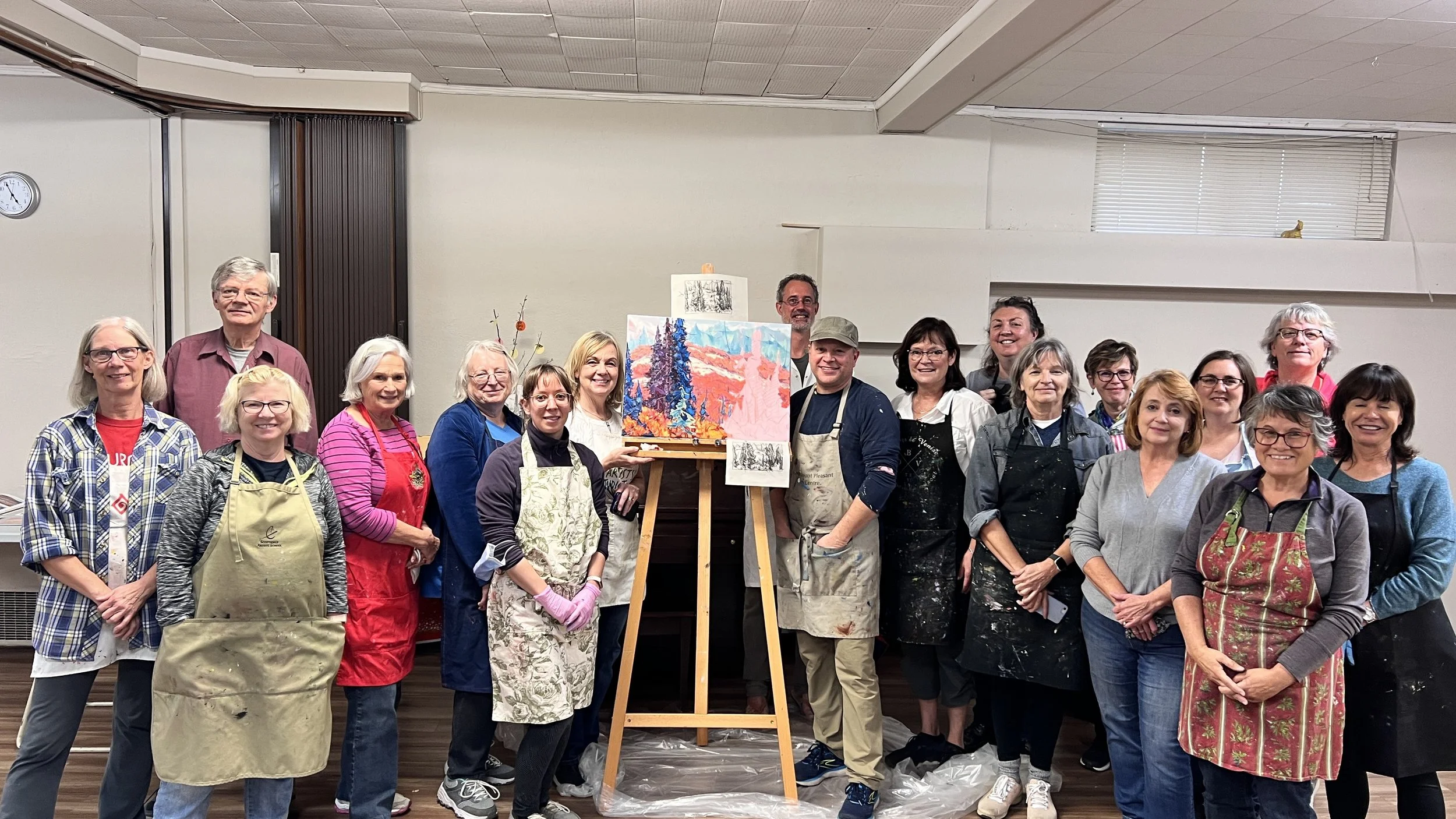 Artist Dominik Modlinski with students during a painting workshop in the Yukon, capturing the rugged northern landscapes and wilderness scenery.