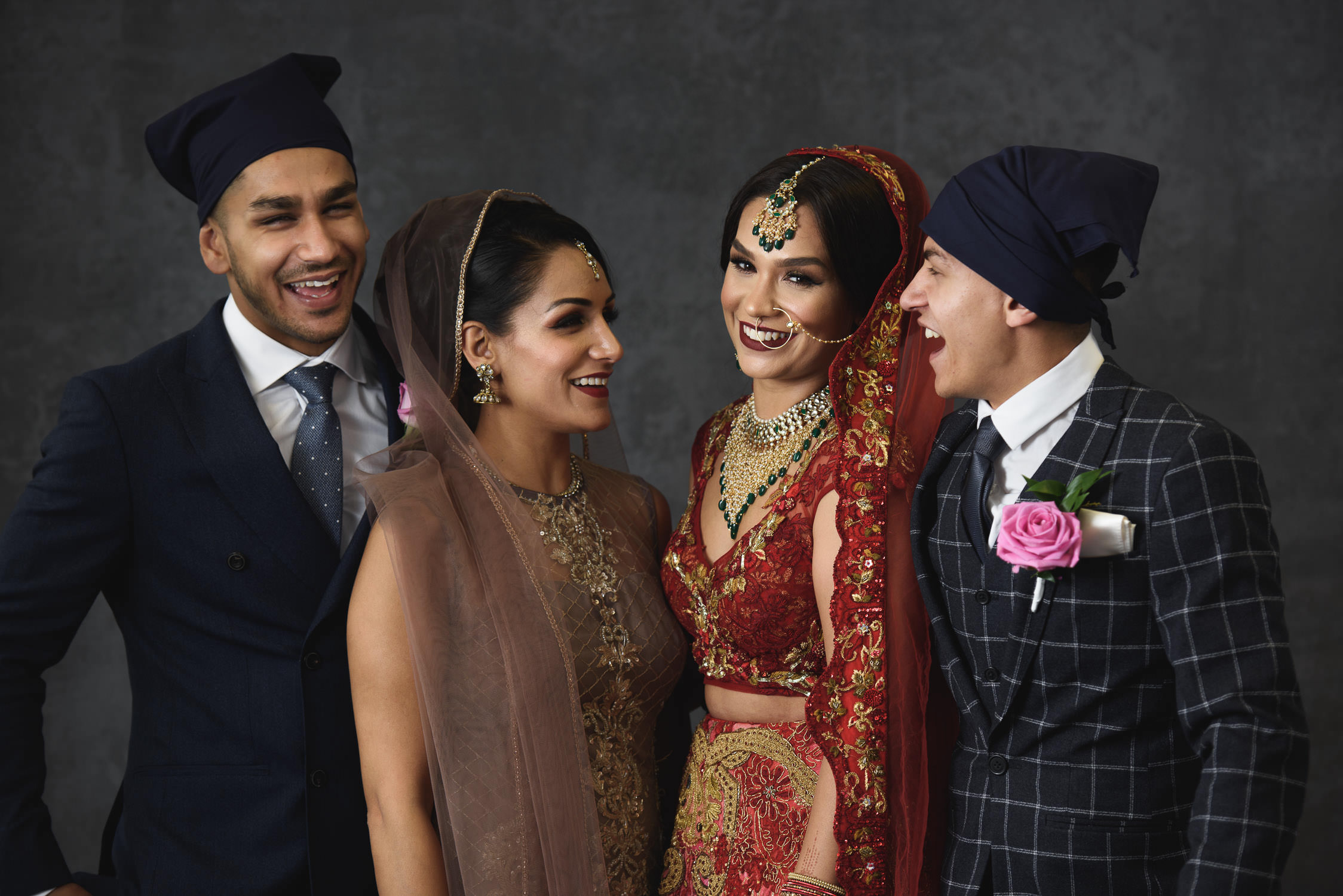 Sikh bride with her family laughing