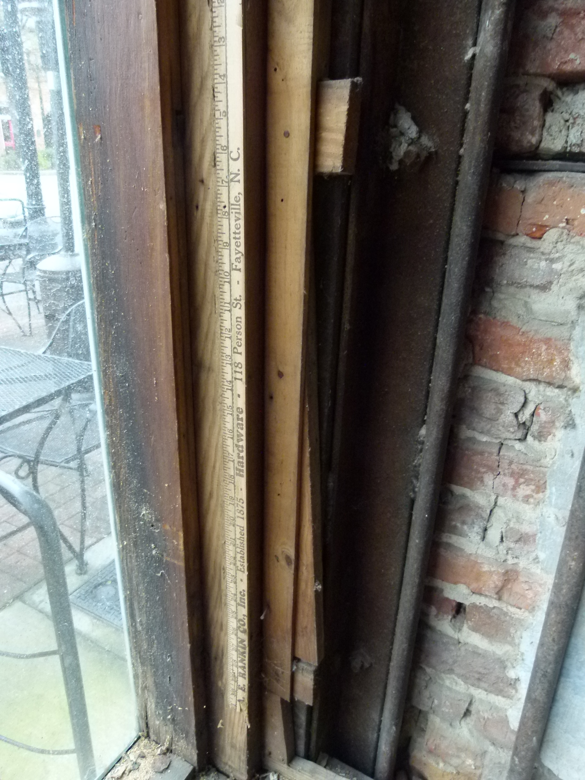 Yardstick used as furring strip found behind the historic storefront after removal