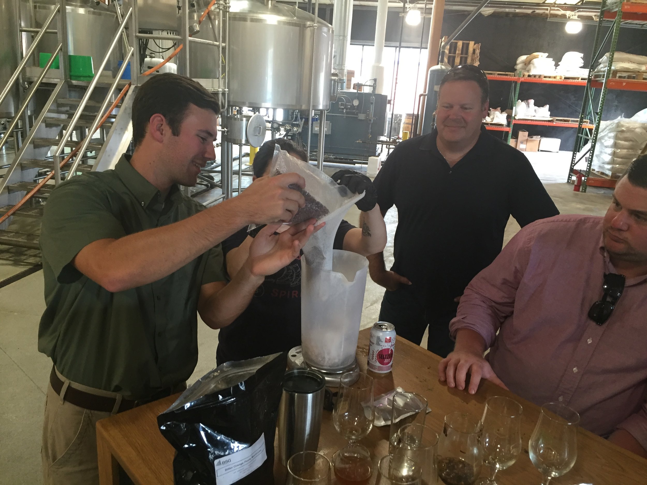Harrison measures out some ingredients for our cask