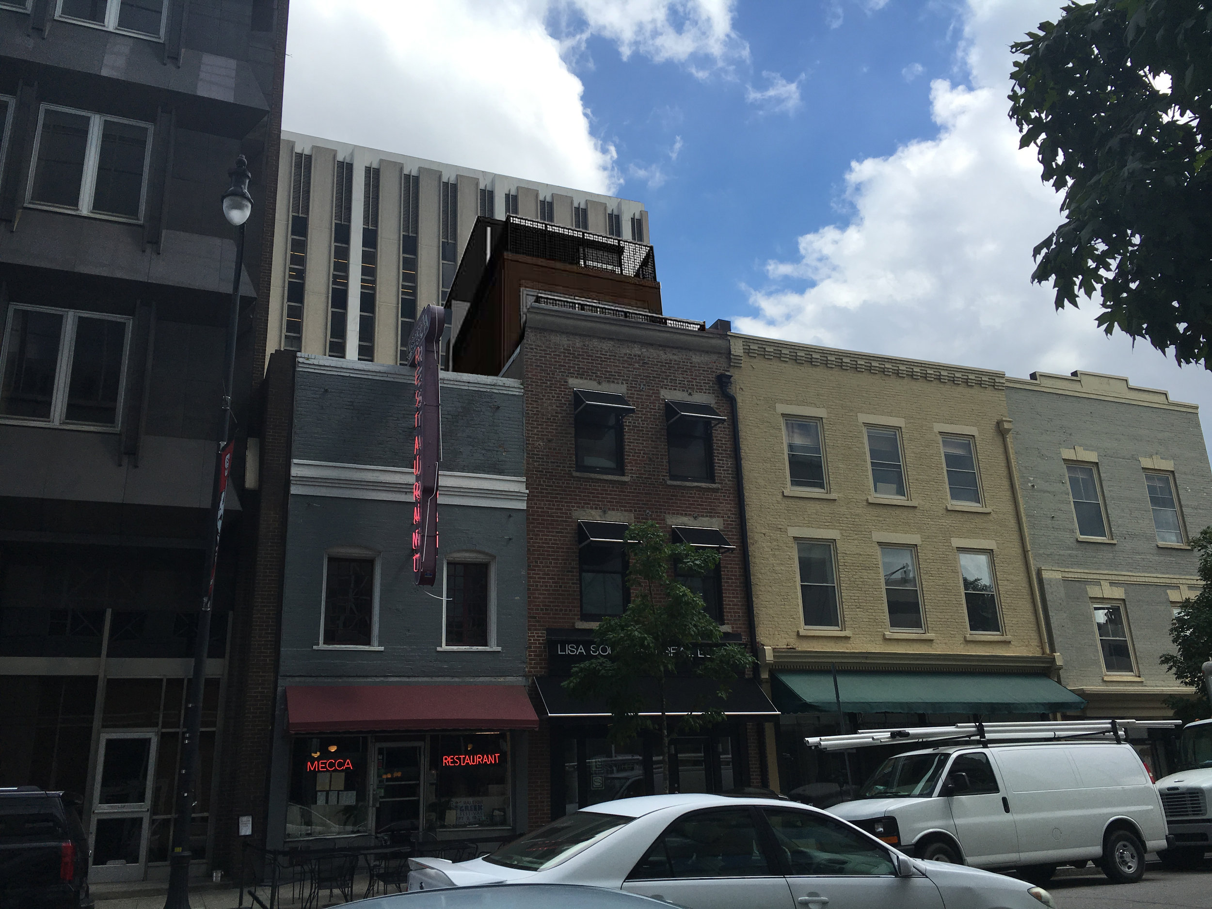 15 E. Martin Street is the red brick building next to the Mecca restaurant. The proposed addition can be seen above the existing third floor. 