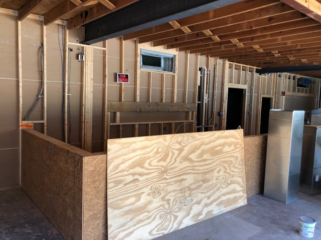  Sheetrock going up behind the bar.  