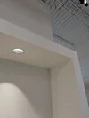 Nook, or overhang in front of a co-working space, with can light