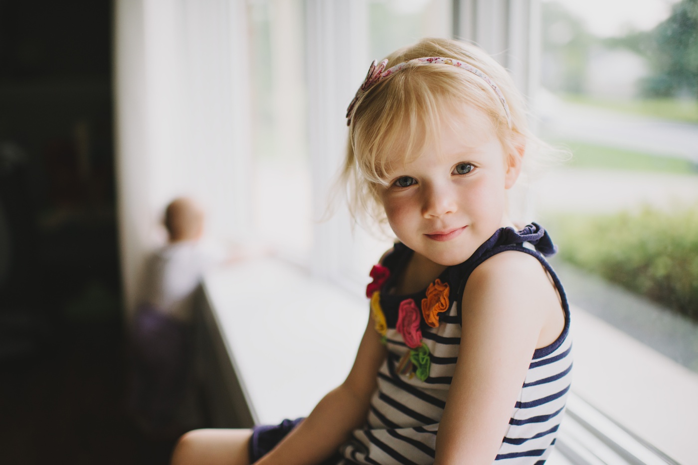 Little girl portrait by window