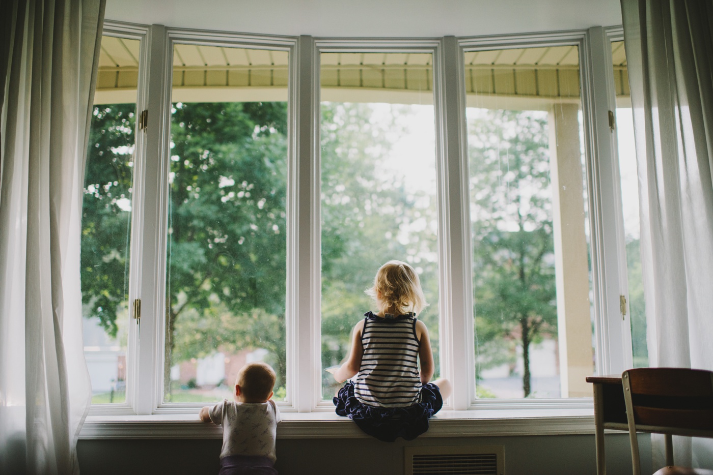 Two little girls in window