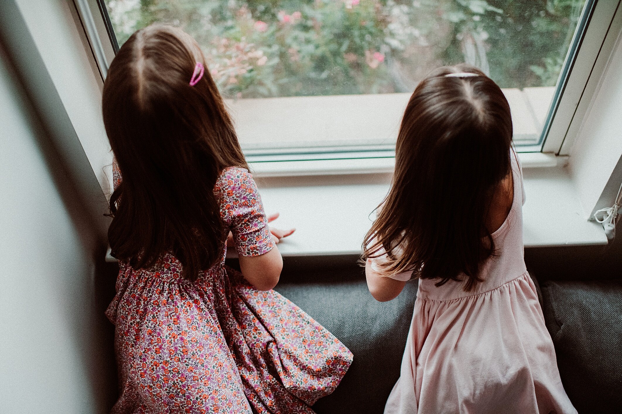 Girls Looking Out Window 