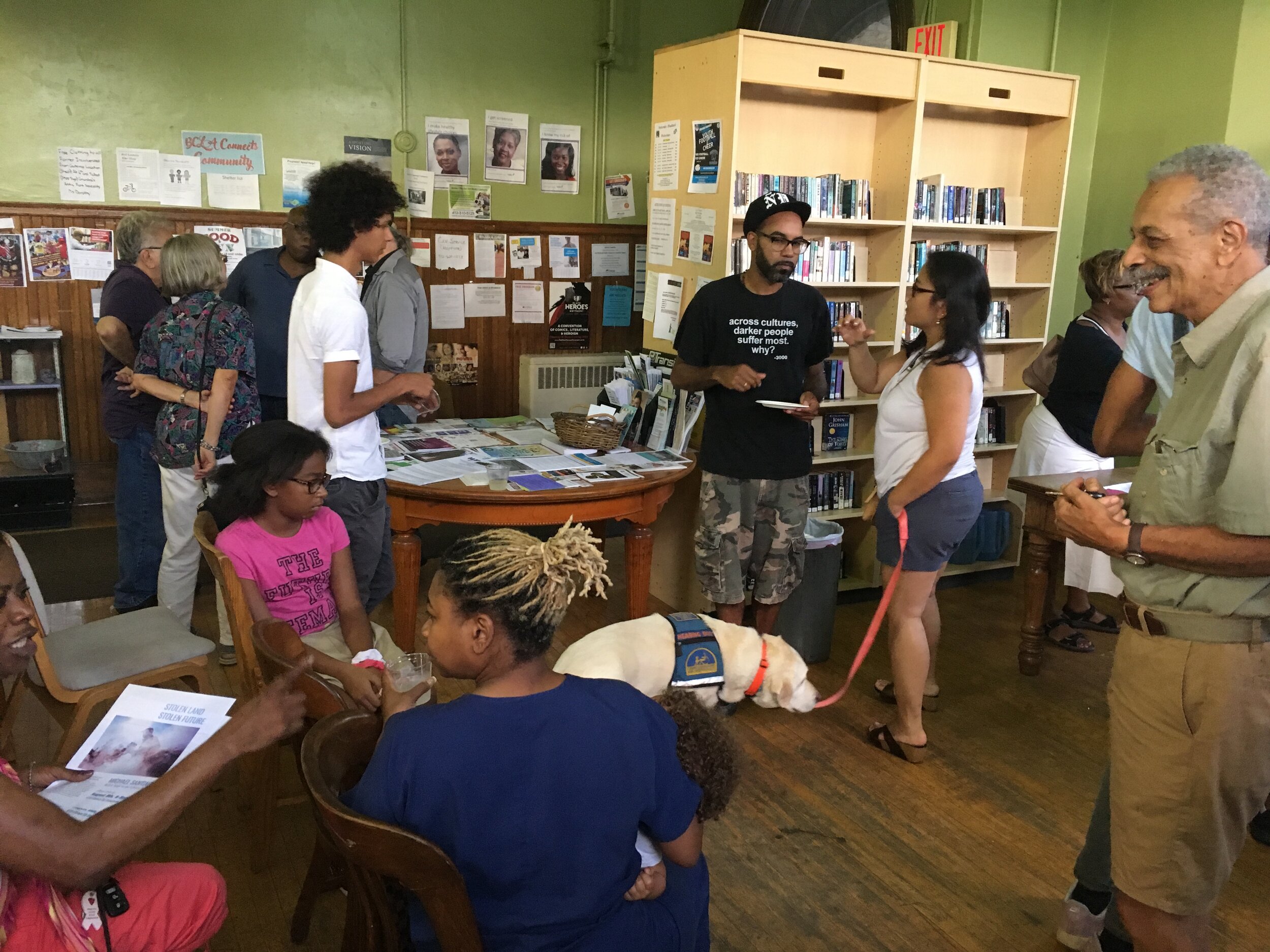 People gathered at the reception for Michael Santiago’s exhibition, Stolen Land, Stolen Futures.