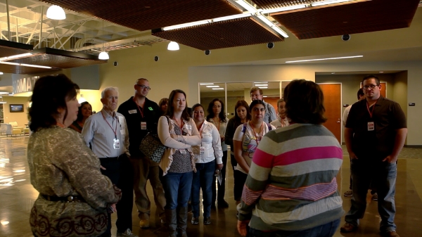 A group on the All Access Tour stopping at Kidside