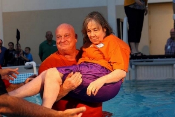 This is Paige. She came to be baptized this Easter and overcame the challenge of not being able to move any of her limbs with the help of Steve who carried her out of her wheelchair and handing her to me to be baptized. If she can overcome paralysis to do something Jesus wants to do in her, certainly we can overcome any obstacle in our way to help people connect to Jesus' church. 