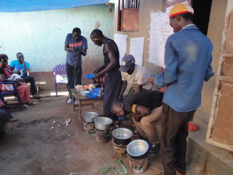 The four brave men who took the challenge to cook. And the judge is capturing everything on his camera.