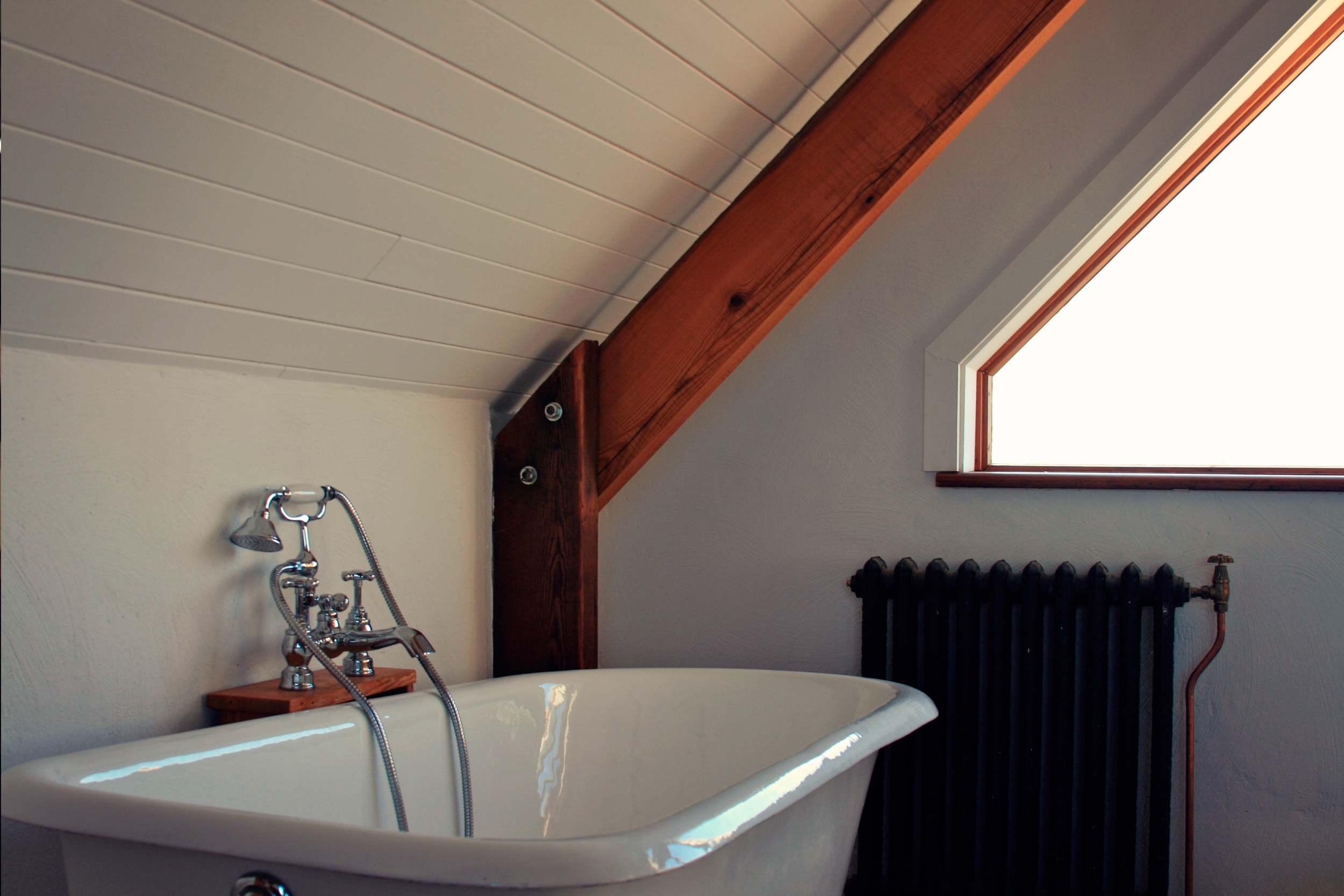 Cast iron bath and radiator on top floor