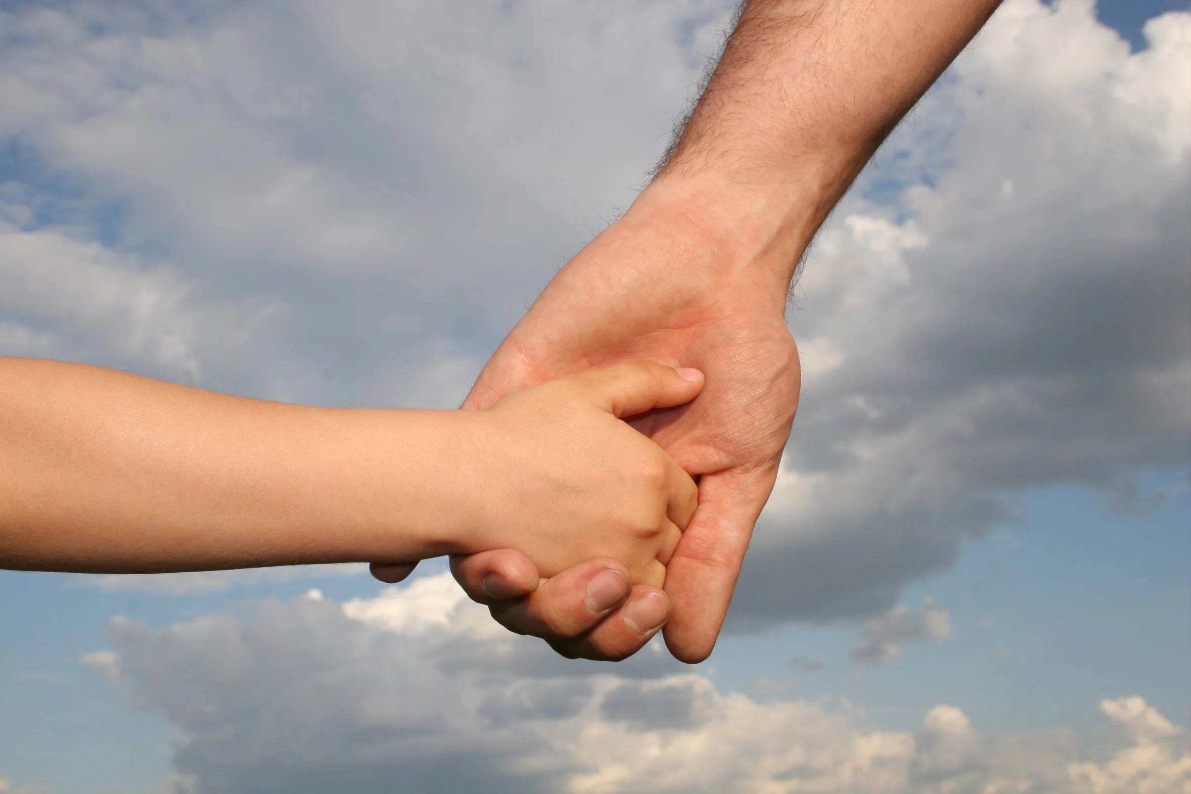 Father holding sons hand_900893_Subscription_L.jpg