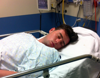 Josh in his hospital bed recovering from his suicide attempt.