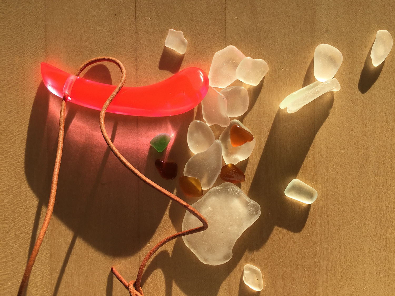 I bought one of Stephen's necklaces, and after we left we hit the beach for our evening walk. When I got back home, I emptied my pockets – the necklace is like a piece of beach glass from Mars!