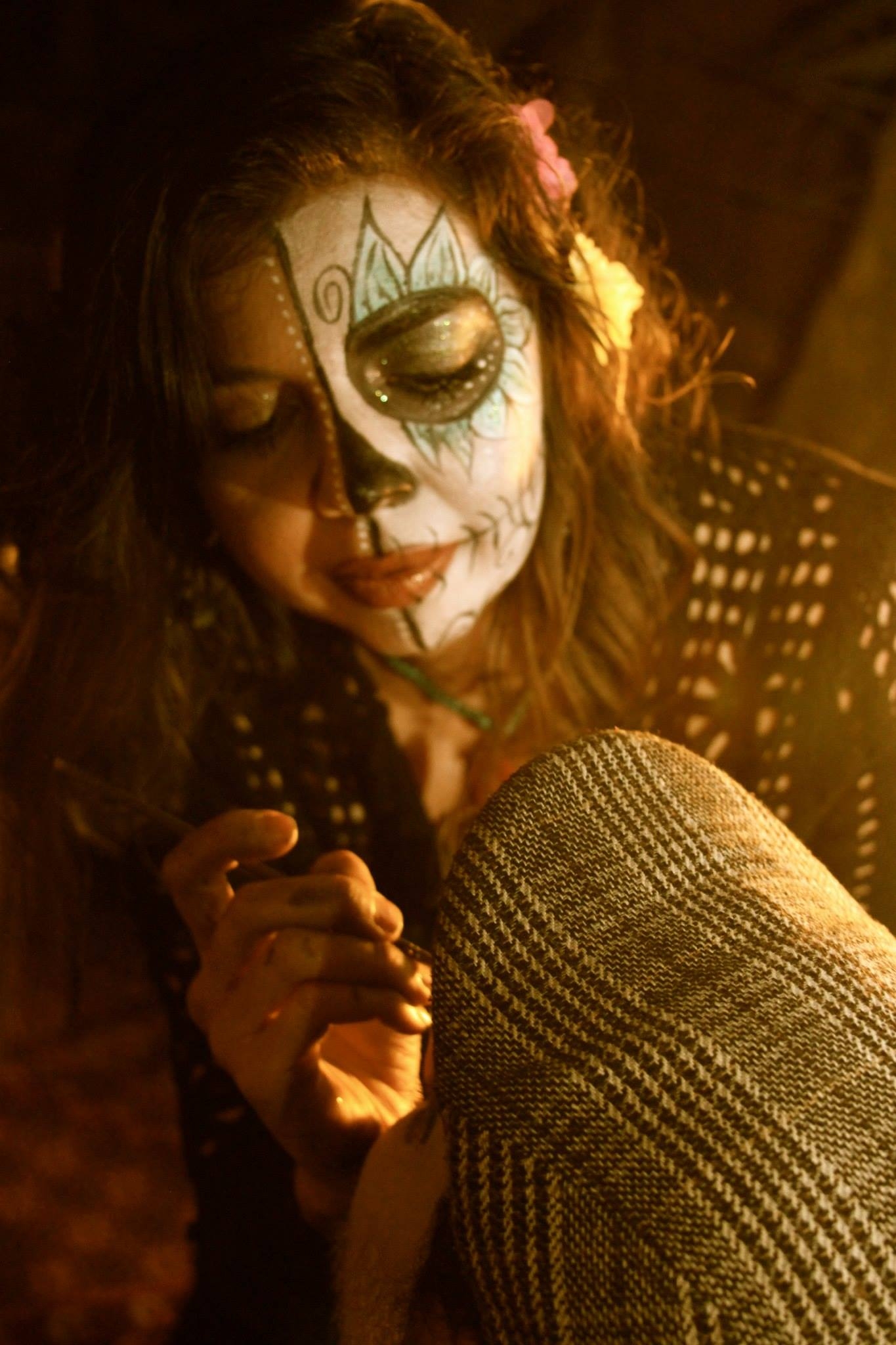 I typically paint faces for Day of the Dead. Here I am at work a couple of years ago.