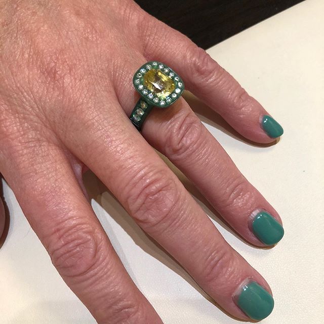 Client trying on her wax model, an important step in the design process.