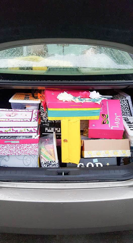 The Trunk of Mrs. Tracys car, packed with shoeboxes ready for drop off. 