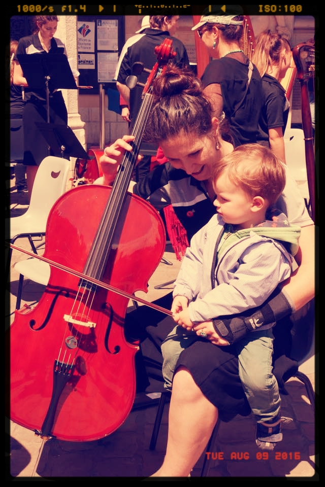 This little guy was just fascinated by the cello section when we played in Arras. So I gave him a quick lesson. Photo courtesy of AYS
