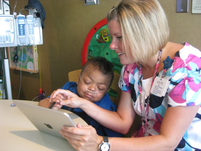 Nevin Jamason with Kristy Rowe and her iPad. ( childrendaytons.org)