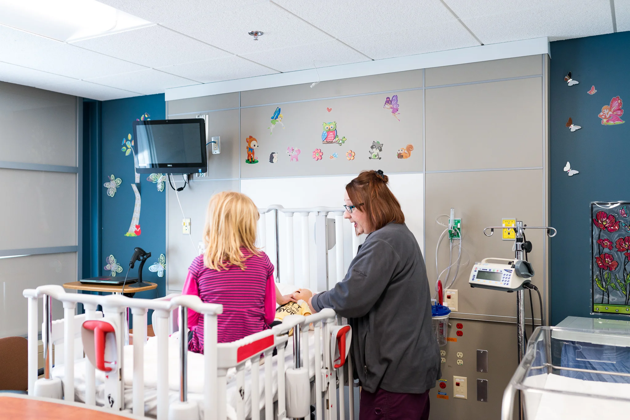 Child life specialist Jennifer talks to patient and develops a relationship