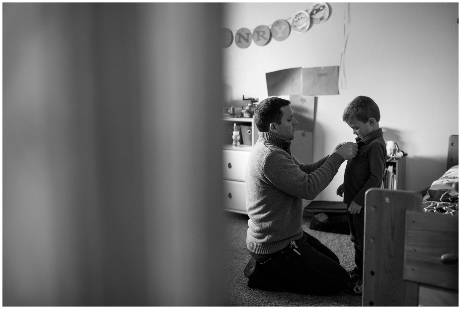 father dresses son in colorado documentary family photo