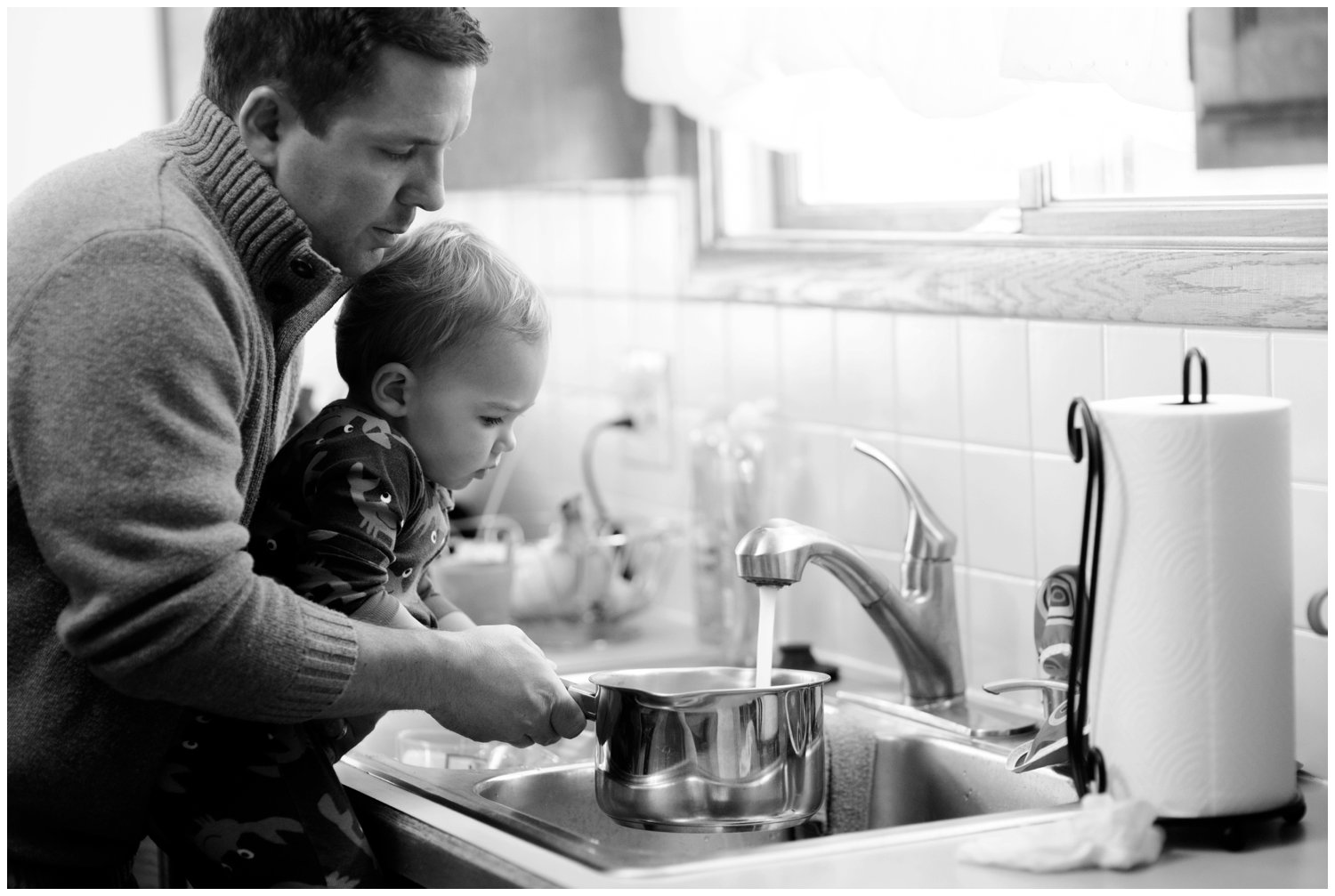 father and son cook dinner together