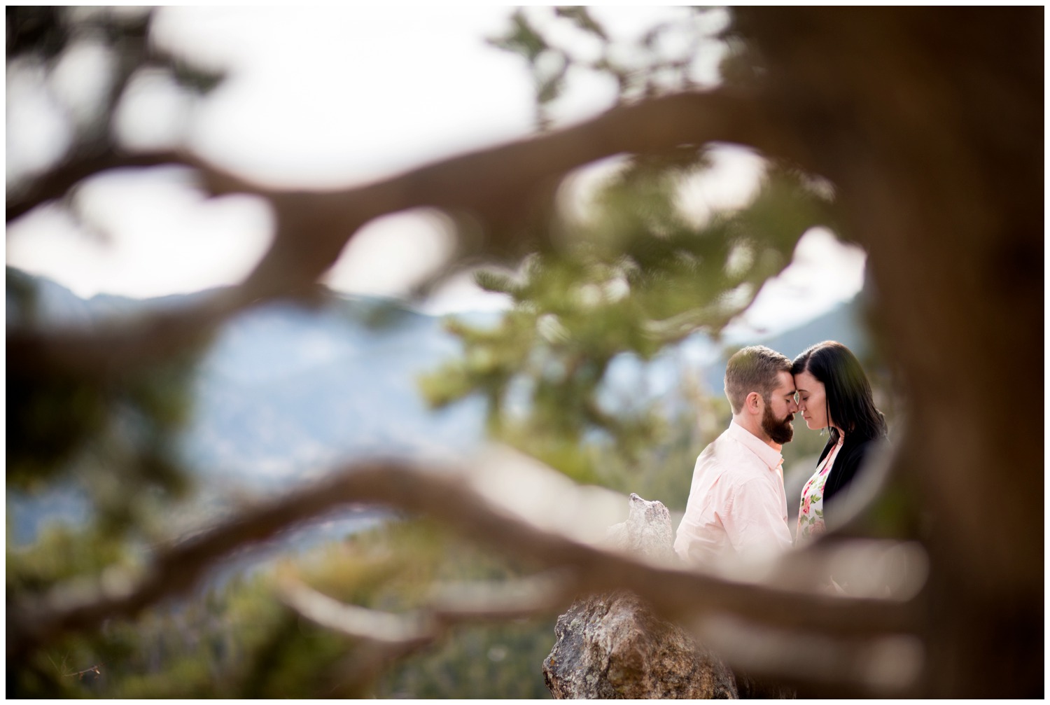 uniquely composed engagement photo on mountain top