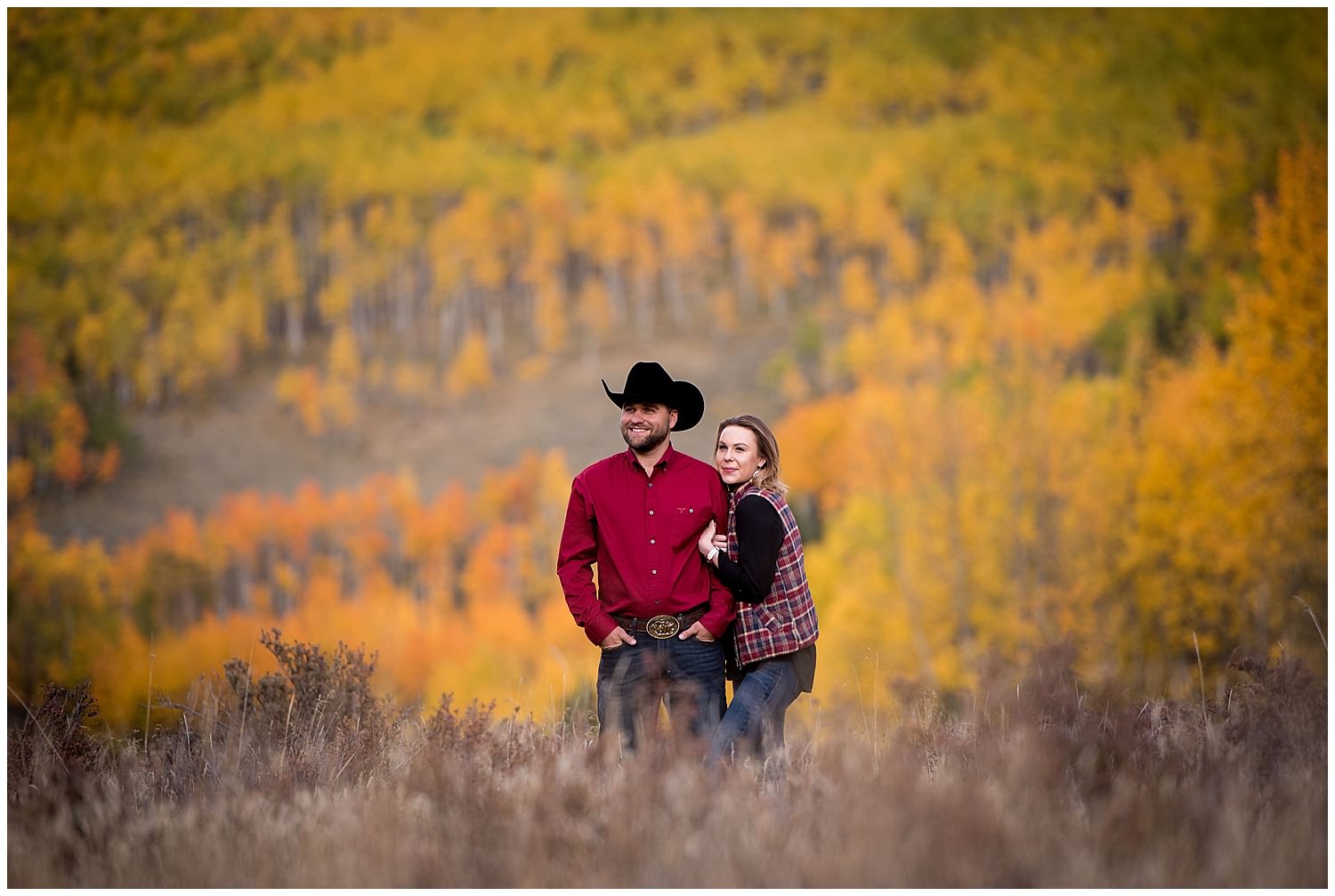 Fall mountain Engagement photo with colorful Aspen trees