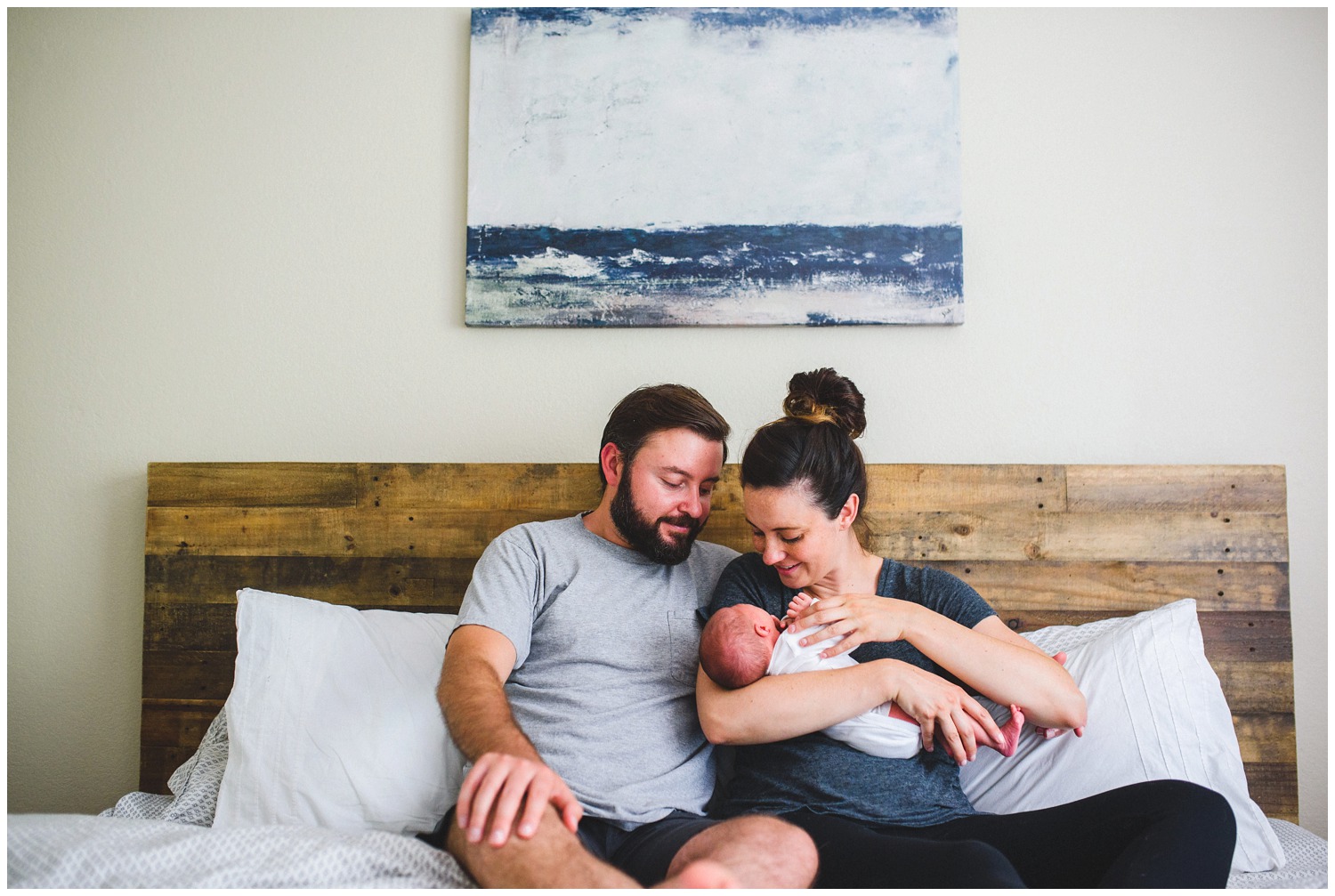 family newborn photo on bed