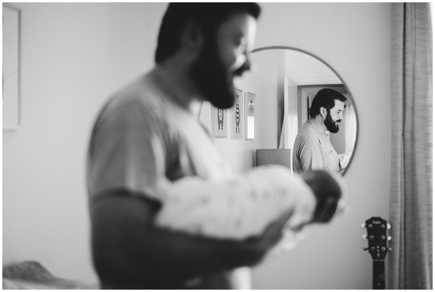 reflection photo dad with newborn