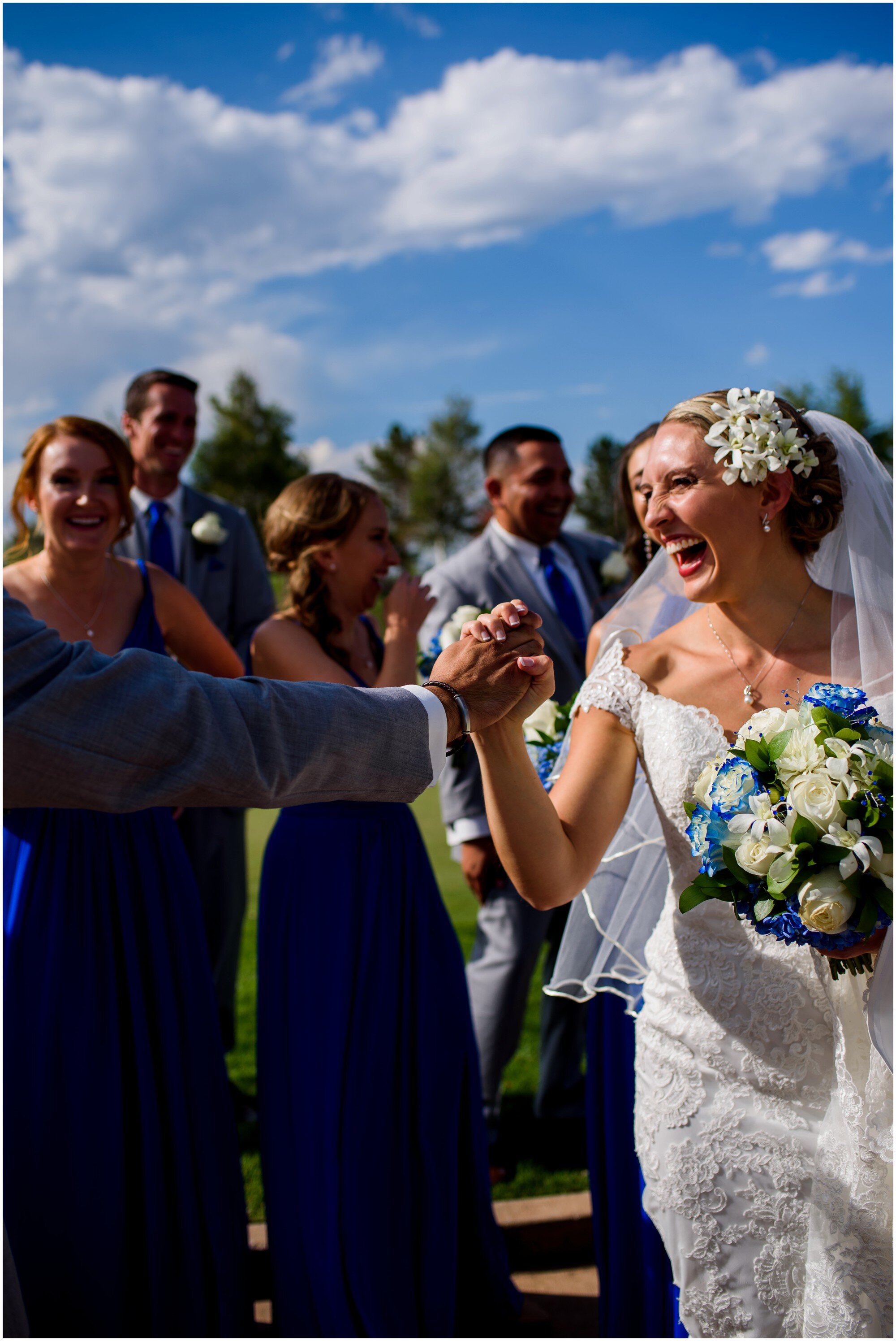 happy bride with blue and white bridal party