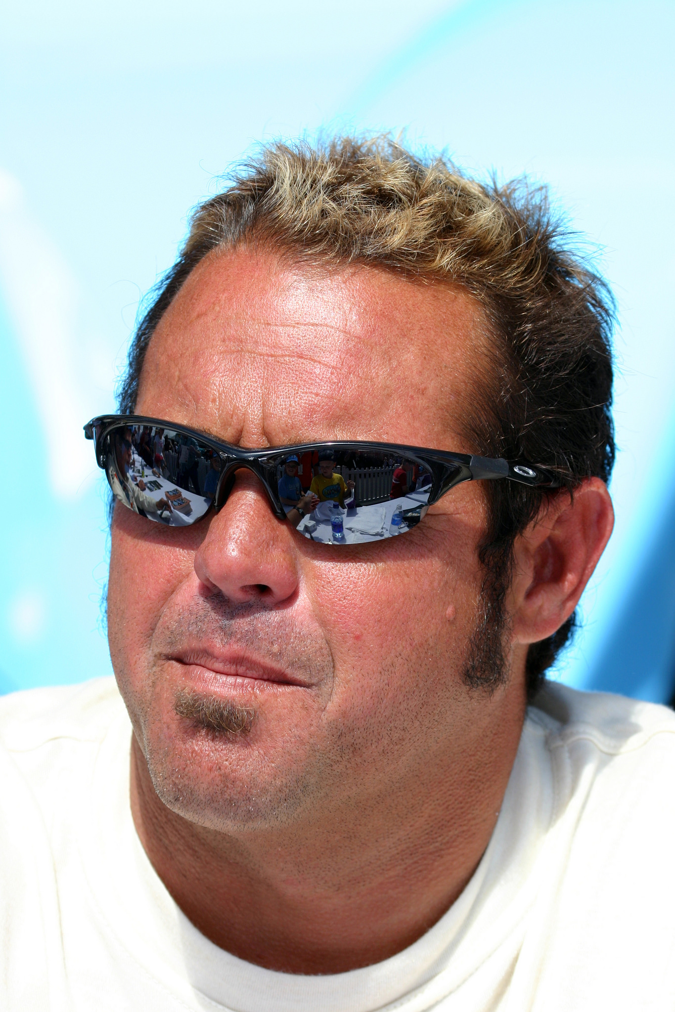 Chad McQueen waiting to sign autographs inside the paddock at Laguna Seca.