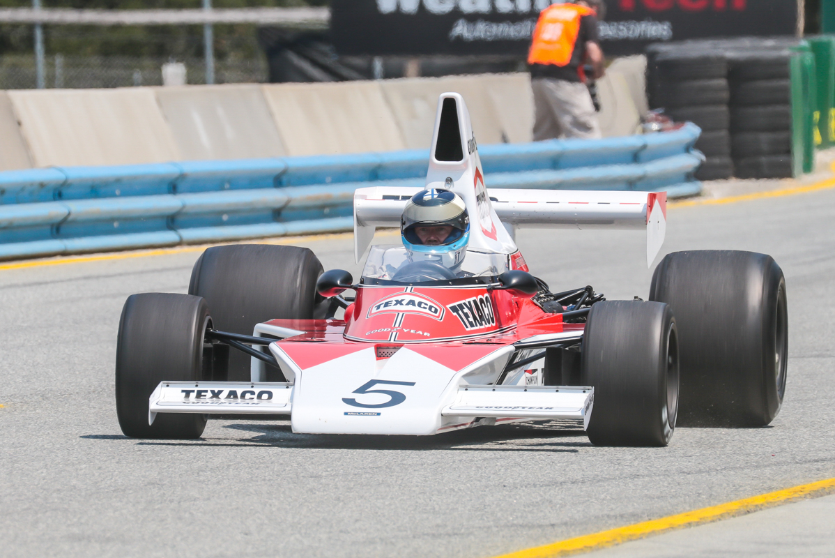 At the '17 Rolex Monterey Motorsports Reunion two time Formula 1 World Champion Mika Häkkinen drove the McLaren M23. Copyright The Loud Pedal