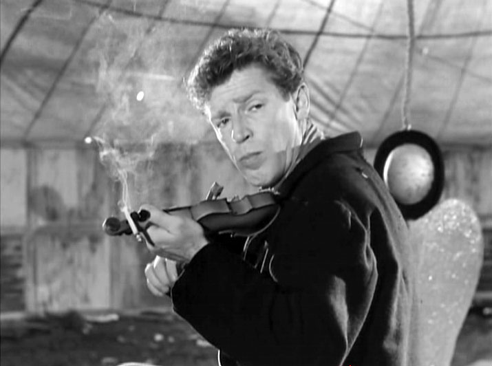  l Matto plays one og Nino Rotas themes on his mini violin in Federico Fellinis La Strada(1954)